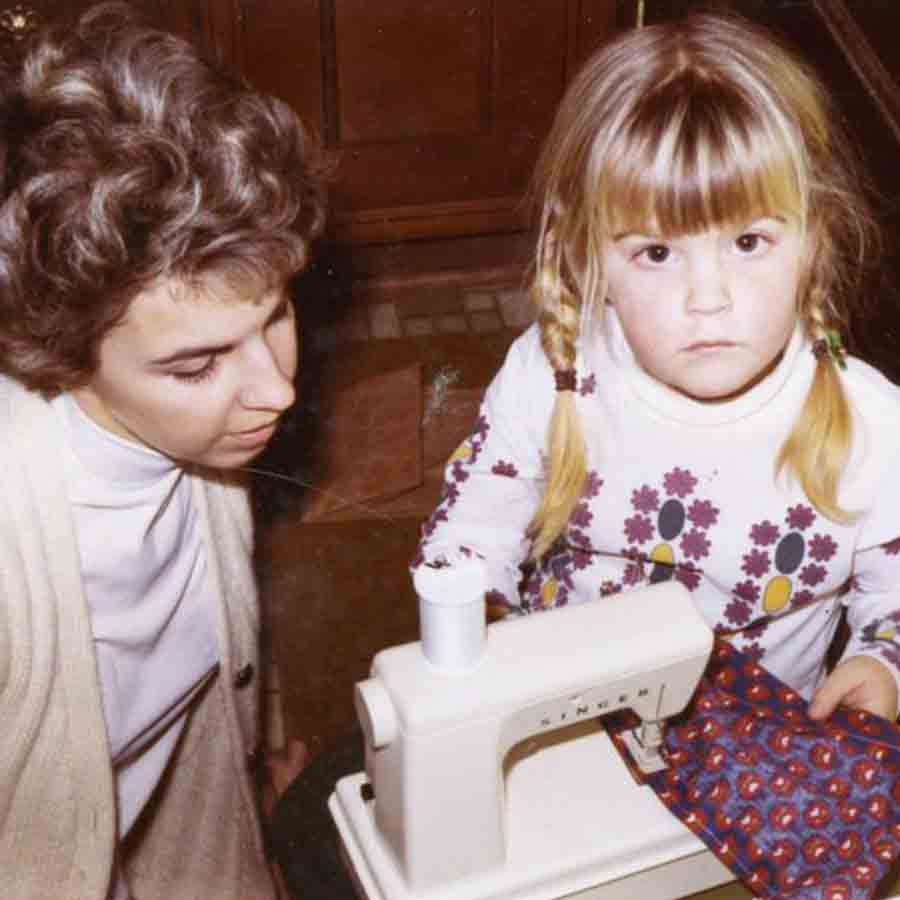 Mom teaching Amy to sew