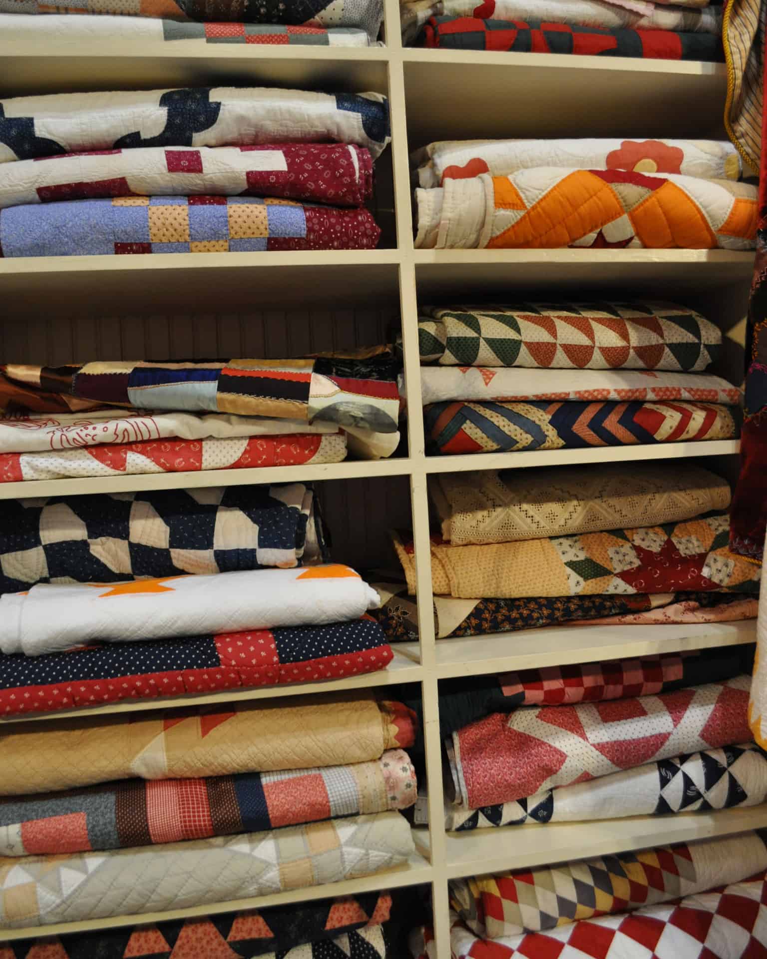 Shelves of quilts