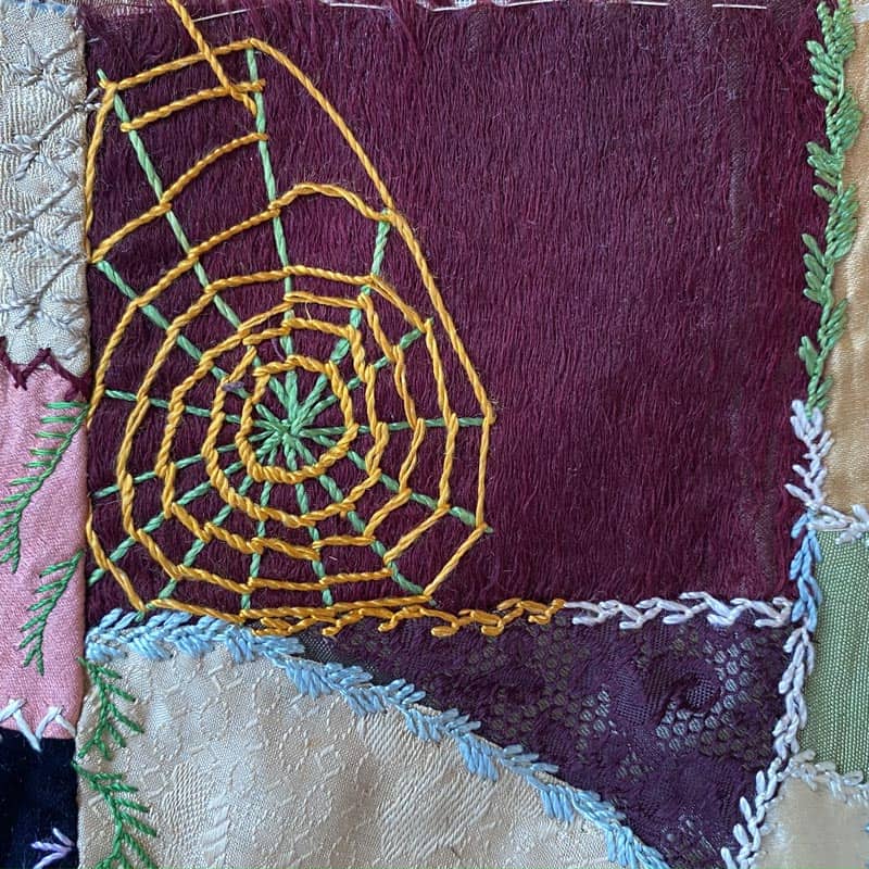 Spider web in crazy quilt