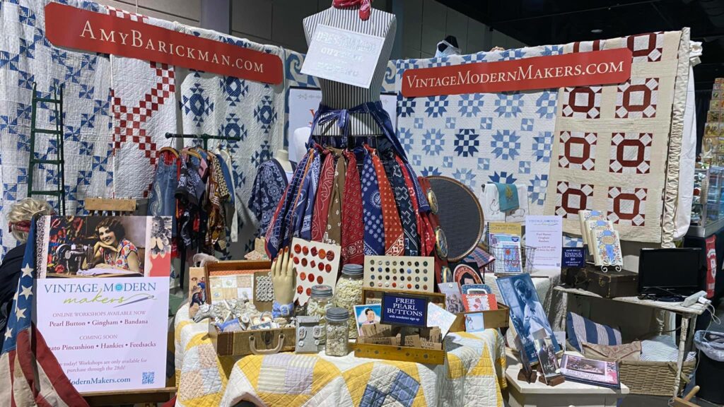 A booth at the Kansas City Regional Quilt Festival shows Amy Barickman's vintage offerings.