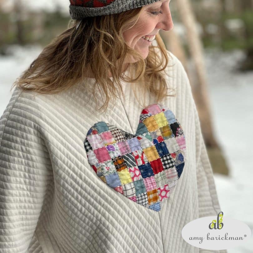 Model wearing Heart To Art Sweatshirt , fabric Postage Stamp Retro