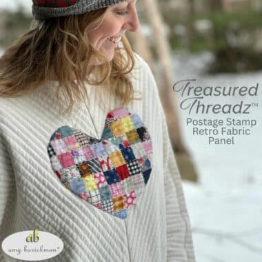 Model wearing sweatshirt made with Heart to Art Applique pattern featuring Treasured Threadz Postage Stamp Retro Fabric Panel